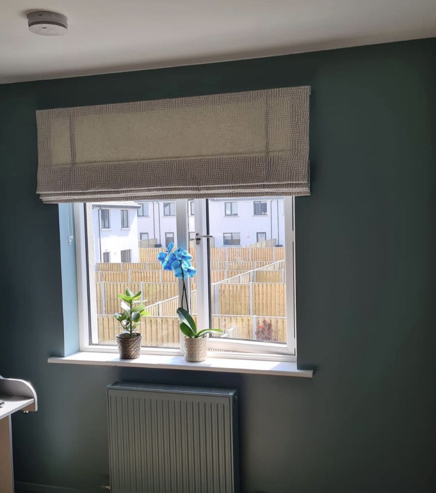 Motorized roller shade in a modern bathroom