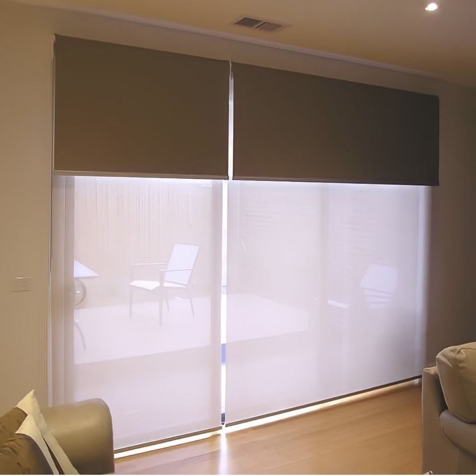 Dual roller shades in a bright living room