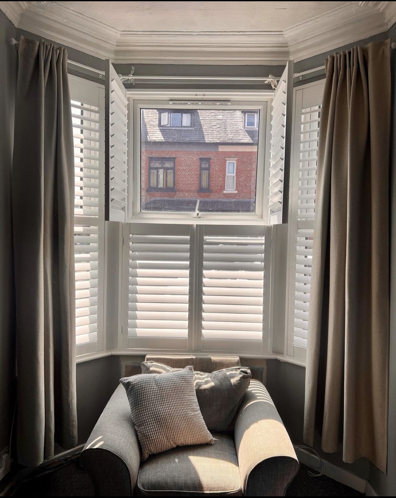 Plantation shutters with drapery